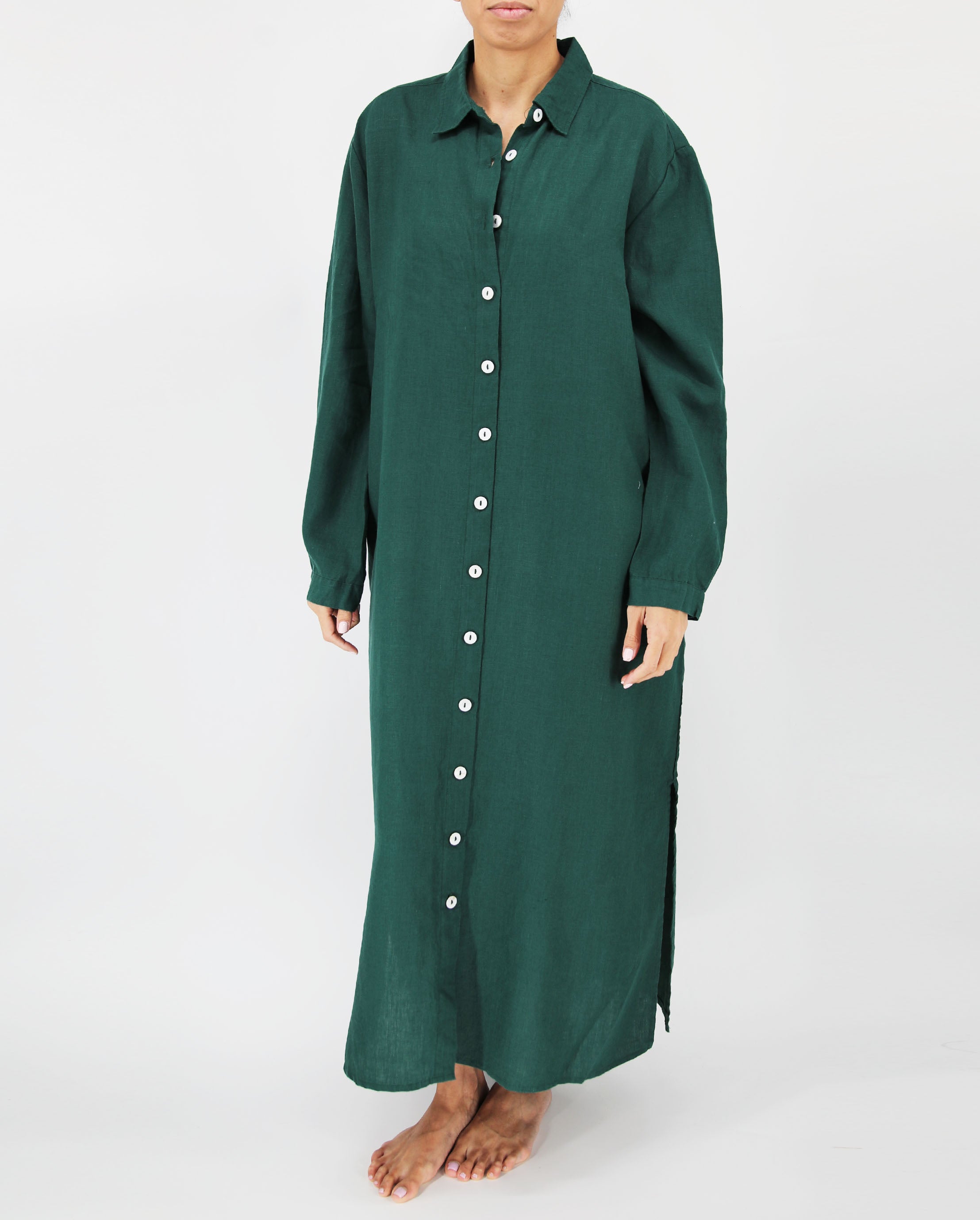 Green dress with buttons on a white background