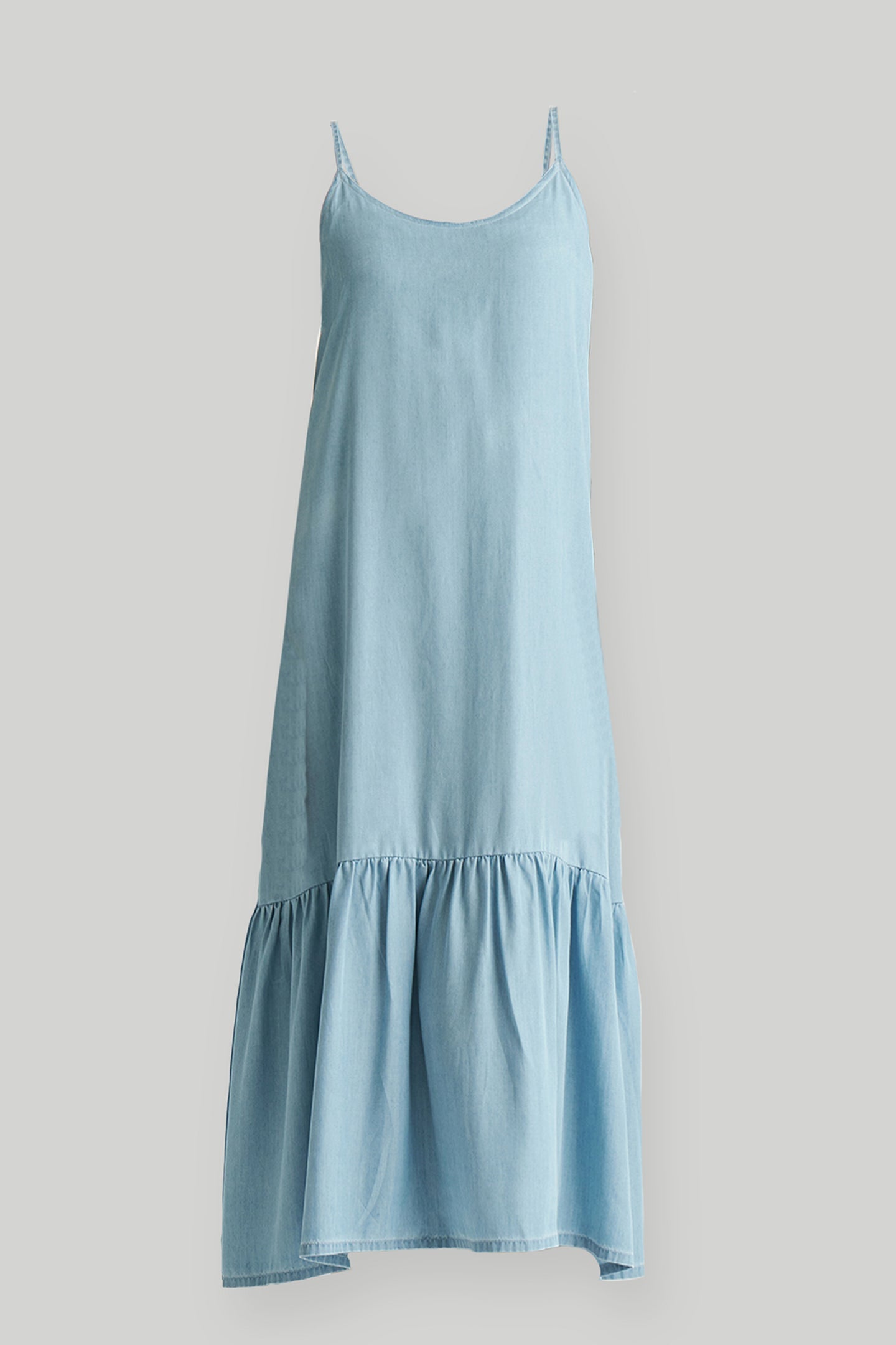 Light blue slip dress on a gray background