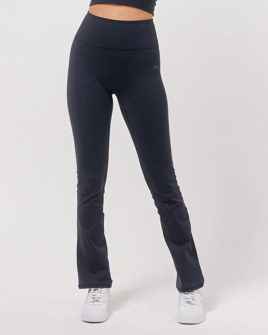 Black leggings worn by a person on a white background