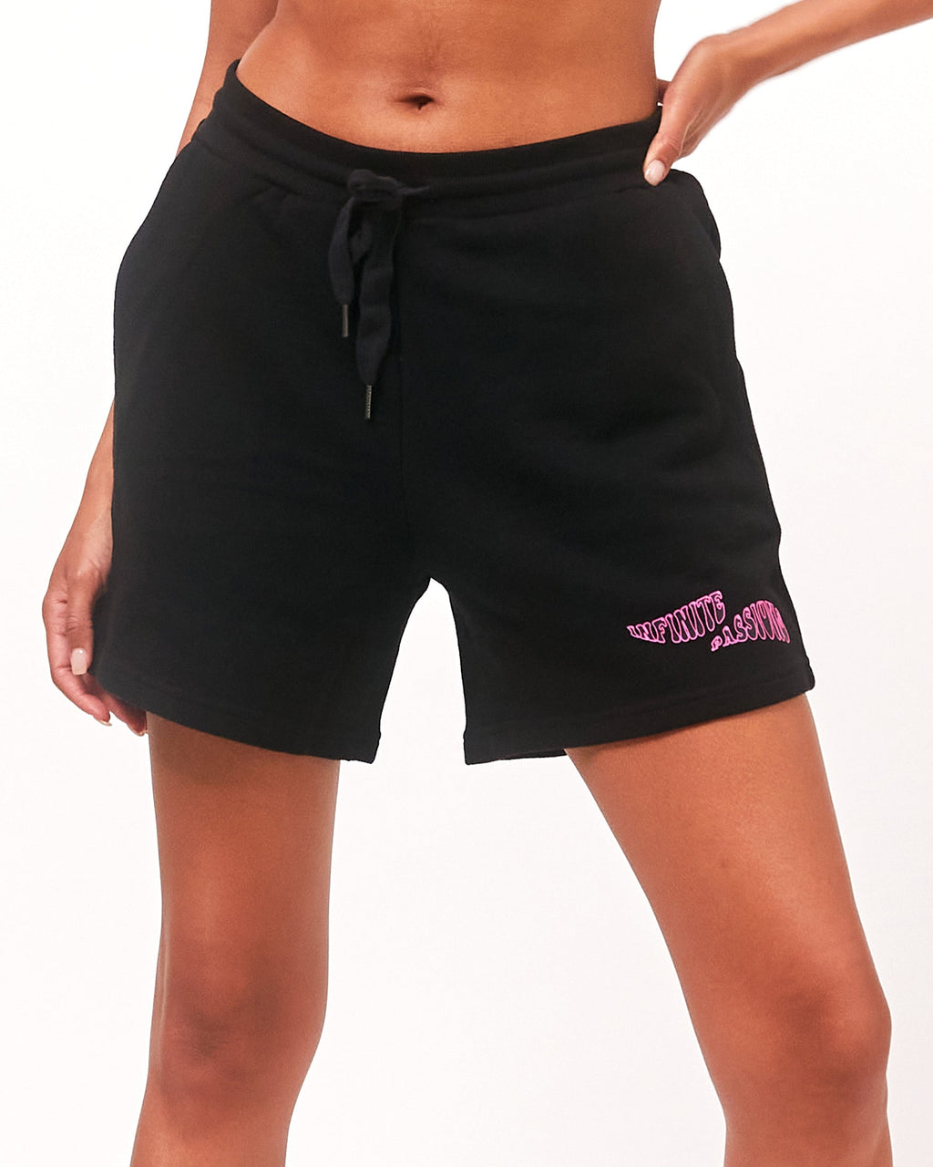 Black shorts with pink text on a white background