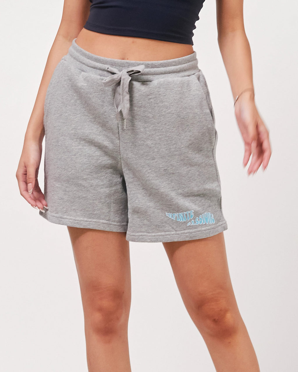 Gray shorts with a brand logo on a white background